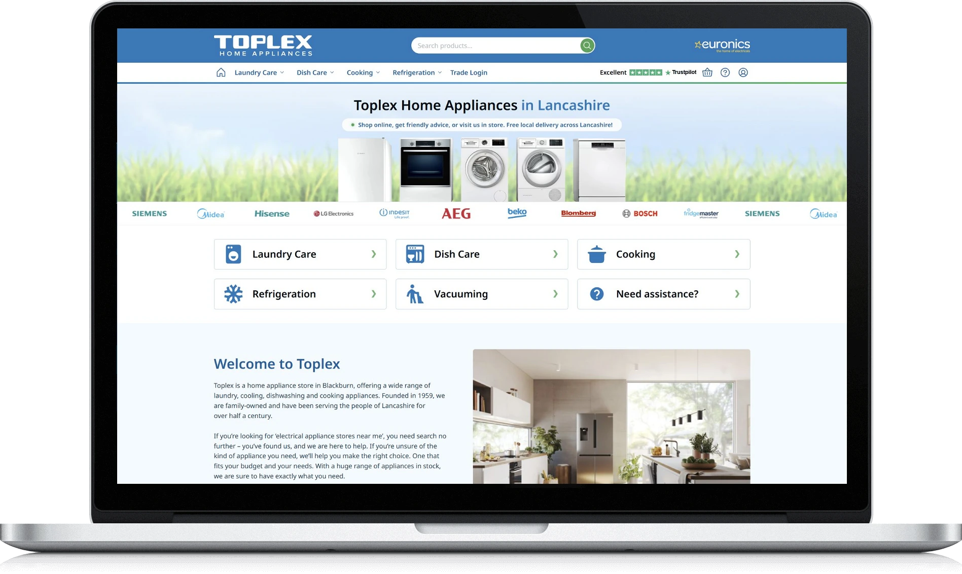 The Toplex Home Appliances homepage shown on a laptop